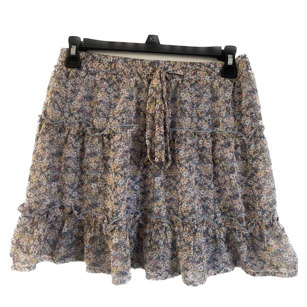 Sienna Sky. Extra Small (XS). Blue mini skirt with multiple colored flowers.